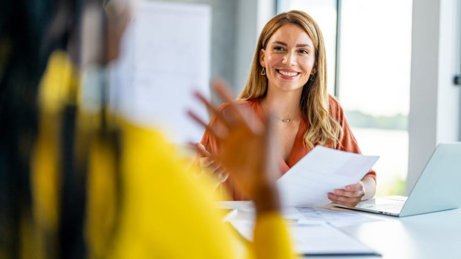 Office manager talks to the new intern