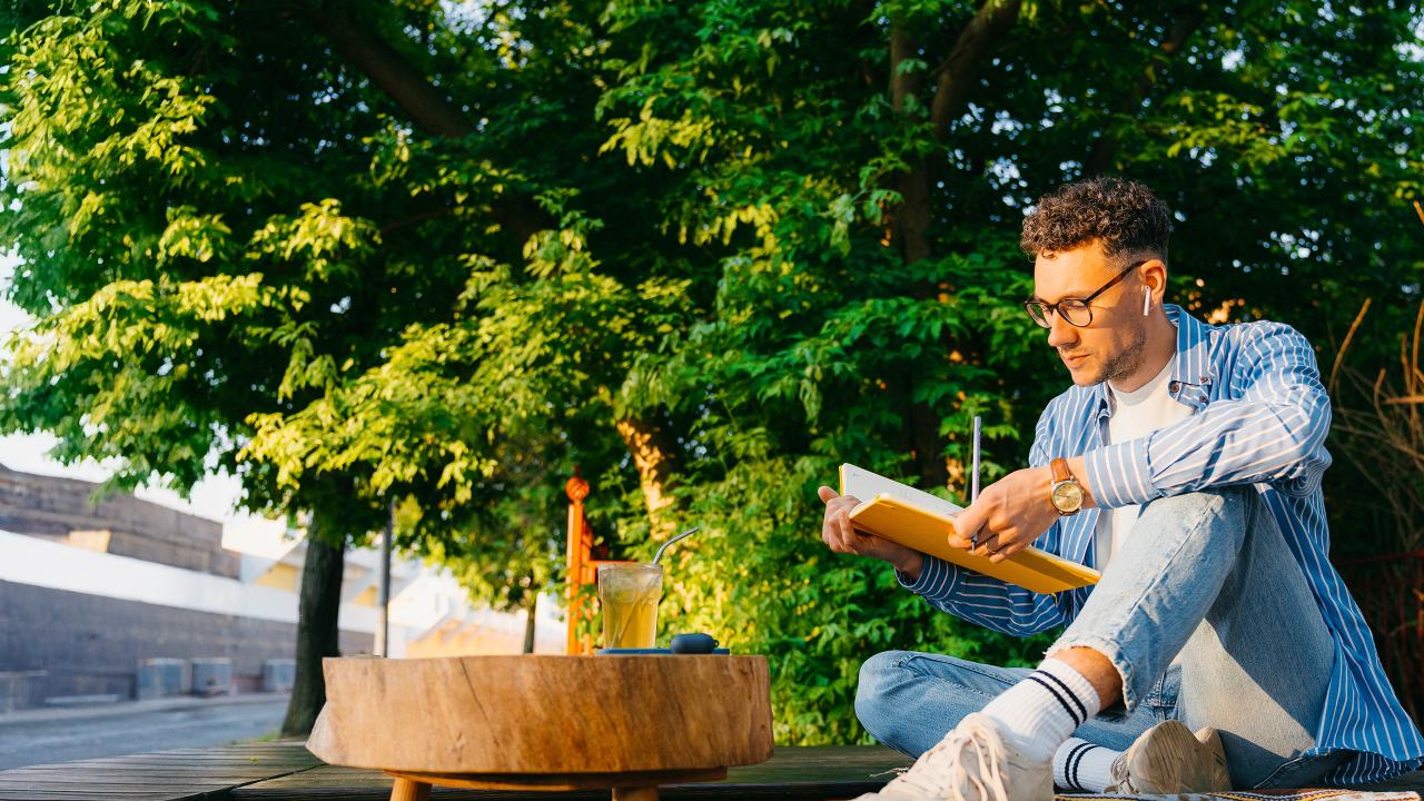 man reading in the park