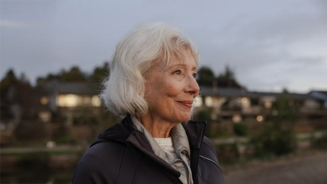 woman looking out with optimism