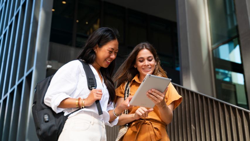 co-workers-using-a-tablet-on-stairs-4901752.jpg co-workers using a tablet on stairs