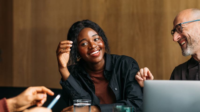 colleagues discussing business and laughing