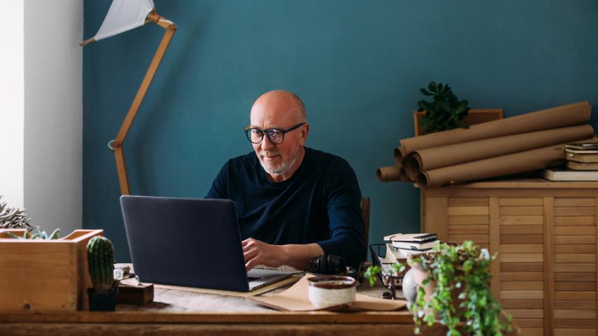 middle aged man working from his home office