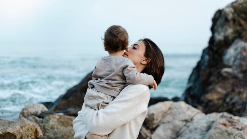 mother holding young son