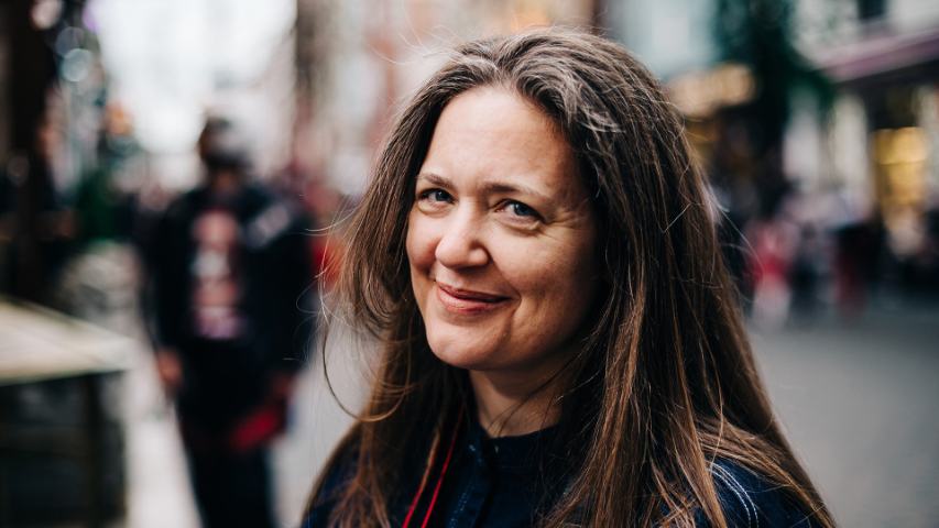 smiling woman on the street