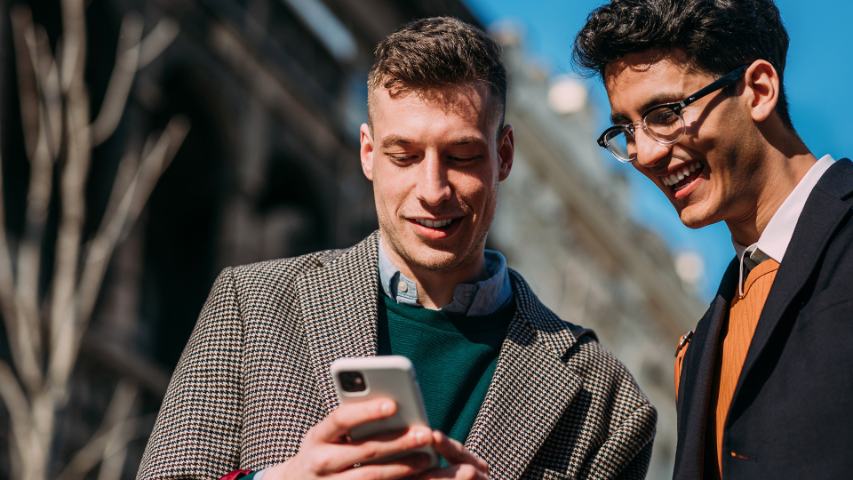  young businessmen checking phone