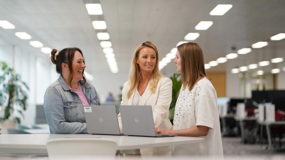 Aegon employees (3 females)  meeting at table