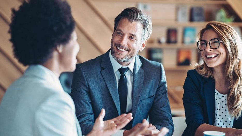 A meeting of three business professionals